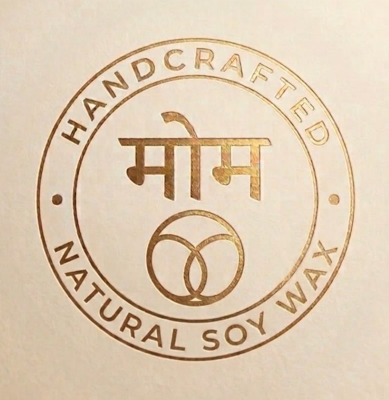 The Maumm seal — मोम embossed in gold